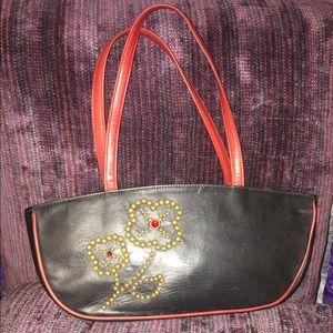 Crescent shaped leather handbag